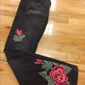 Blackwashed denlm with rose applicates.